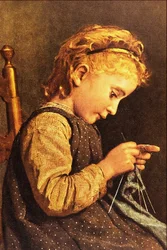 Kleines Mädchen beim Stricken